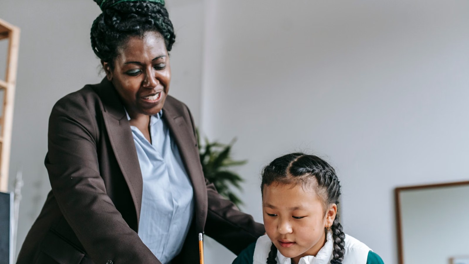A teacher talking kindly with a student