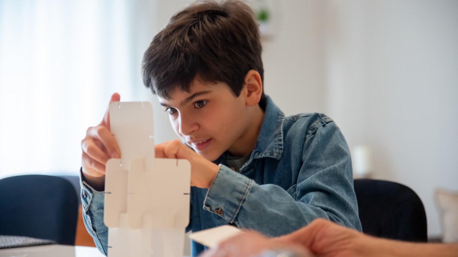 A boy building with blocks