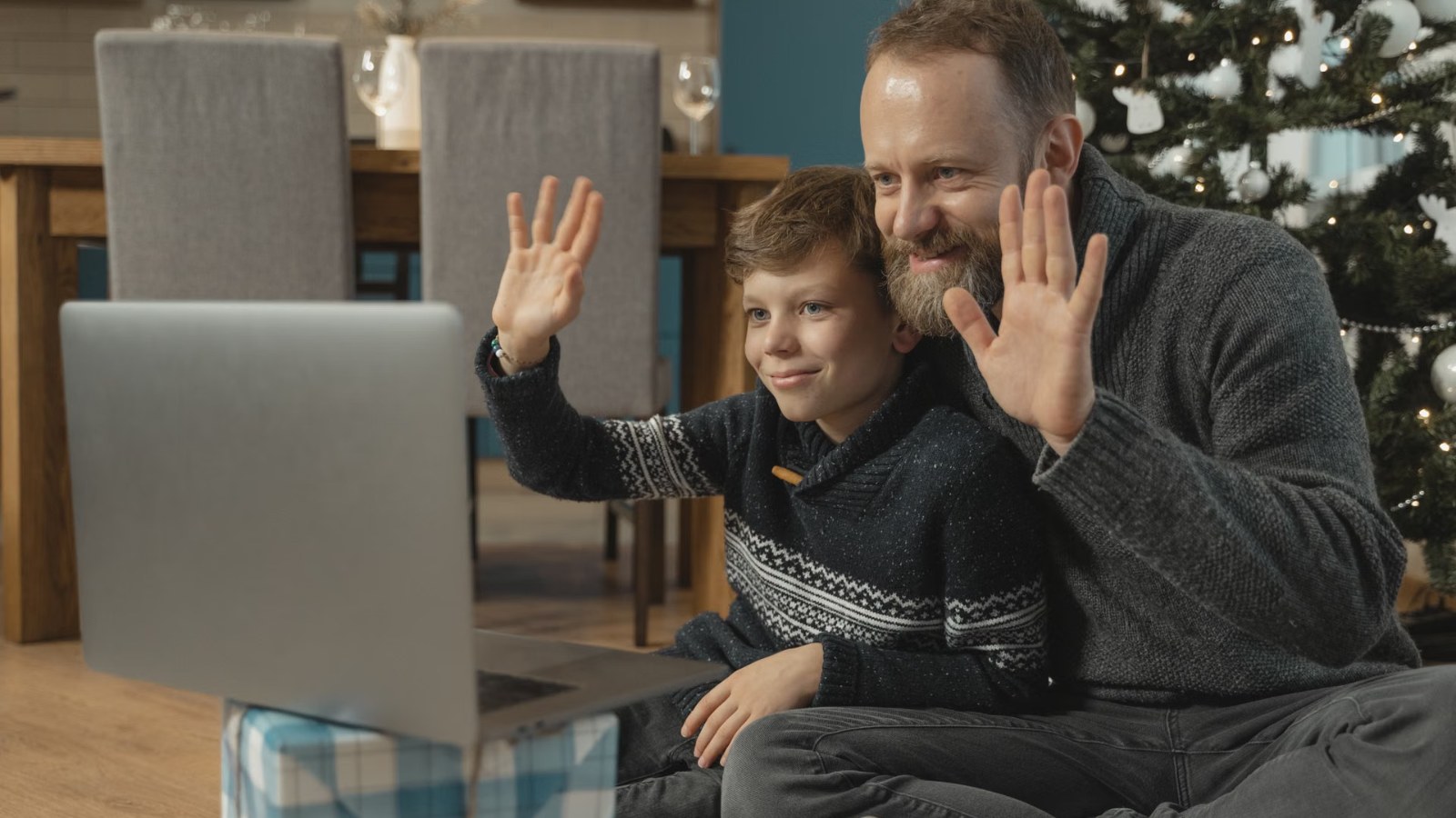 A child waving during a video call