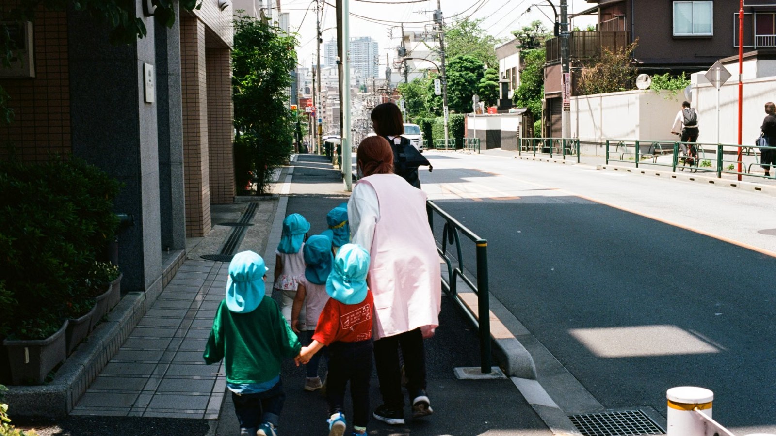 Children walking along a street in Japan
