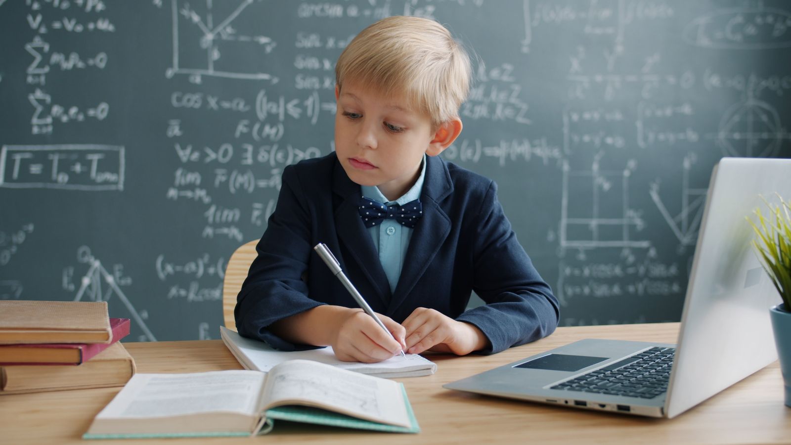 A child working through a math worksheet at a bright kitchen table