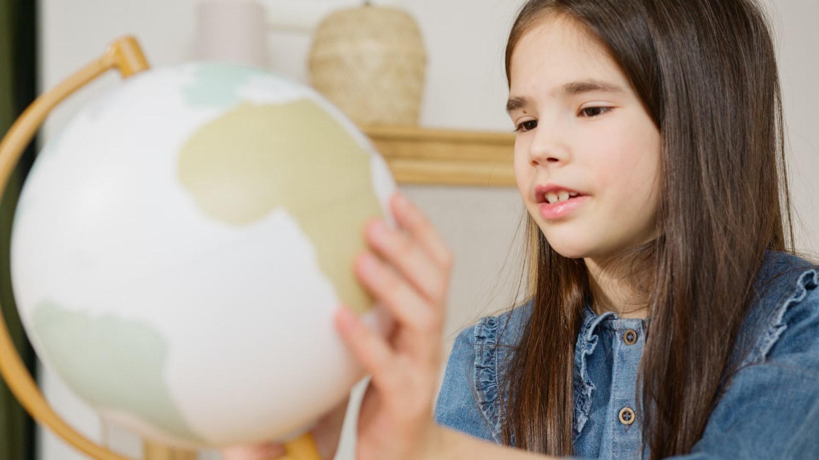 A girl holding a globe