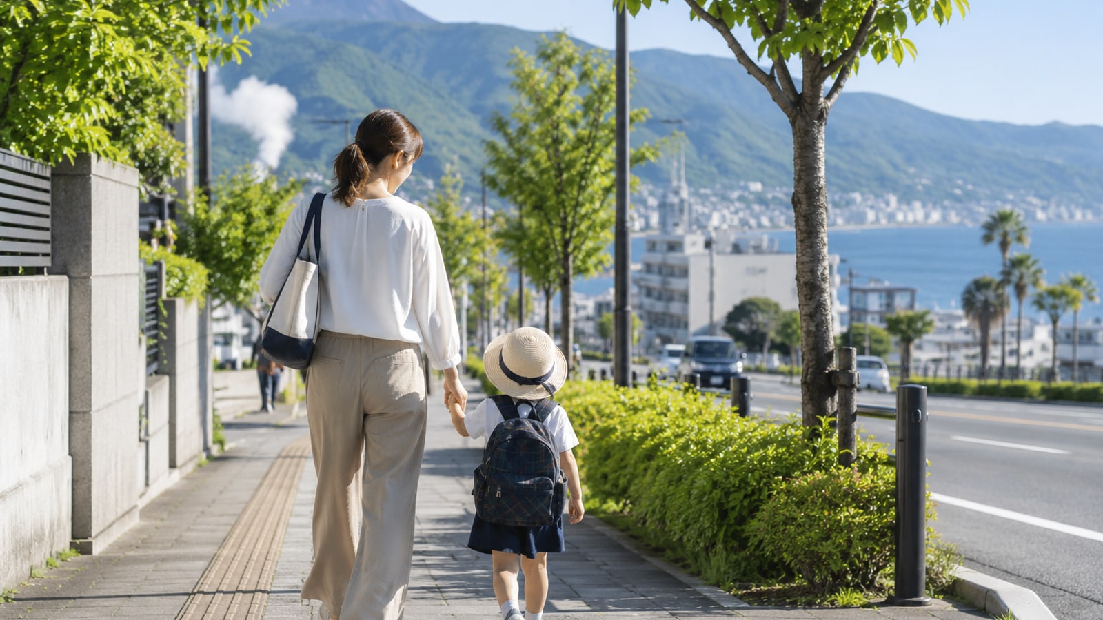 親子が別府市内の施設案内を確認する様子のイメージ
