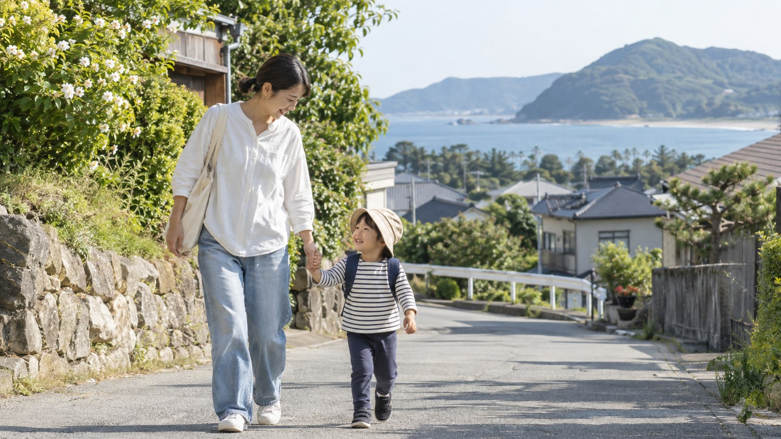 糸島市の住宅地で保護者と子どもが通園するイメージ