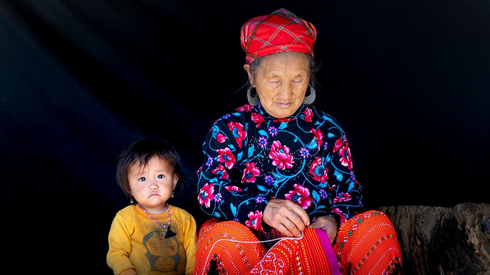 A grandmother and her grandchild spending time together at home