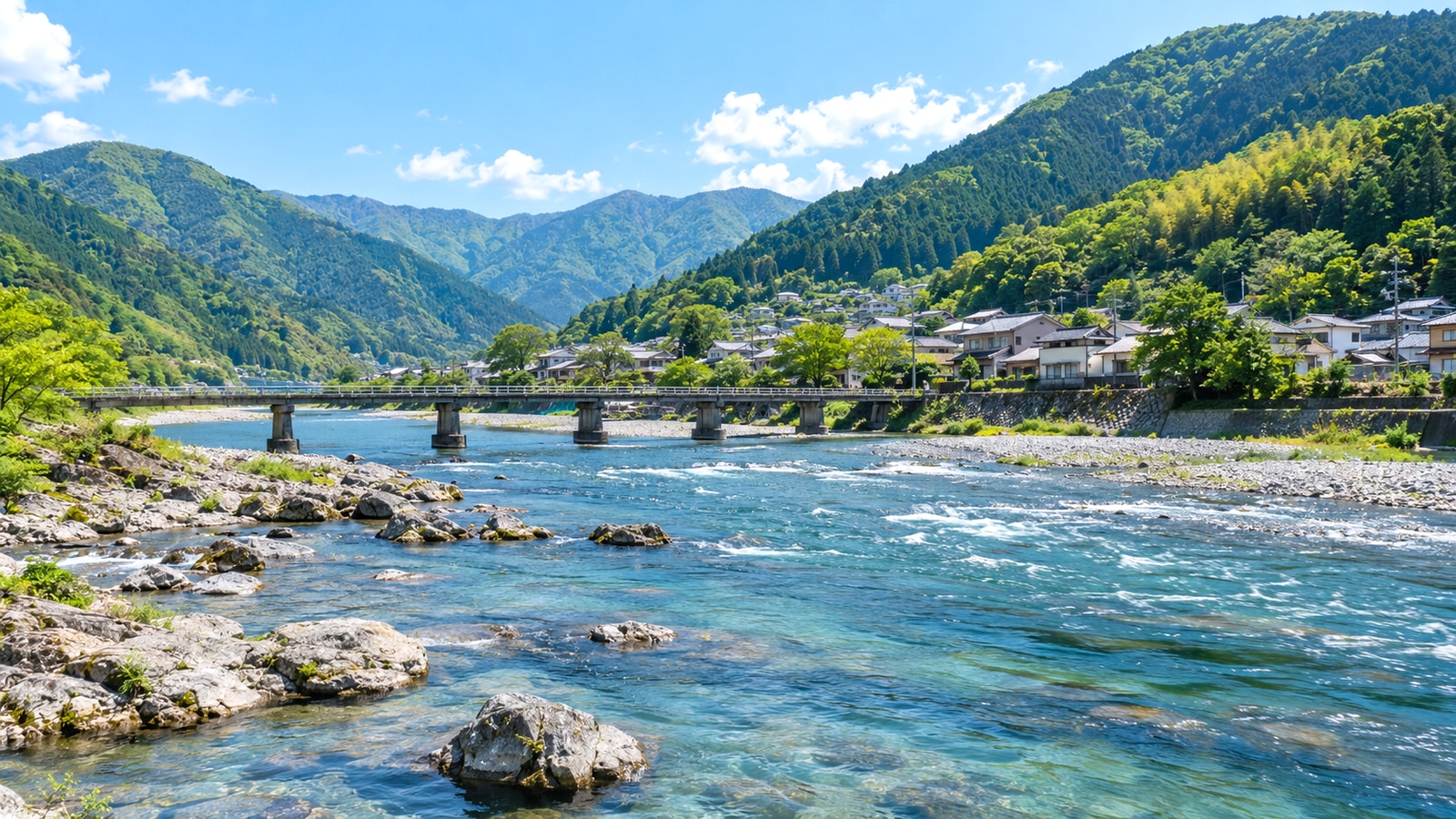 吉野川流域の山並みと町の風景をイメージした徳島県西部の景色